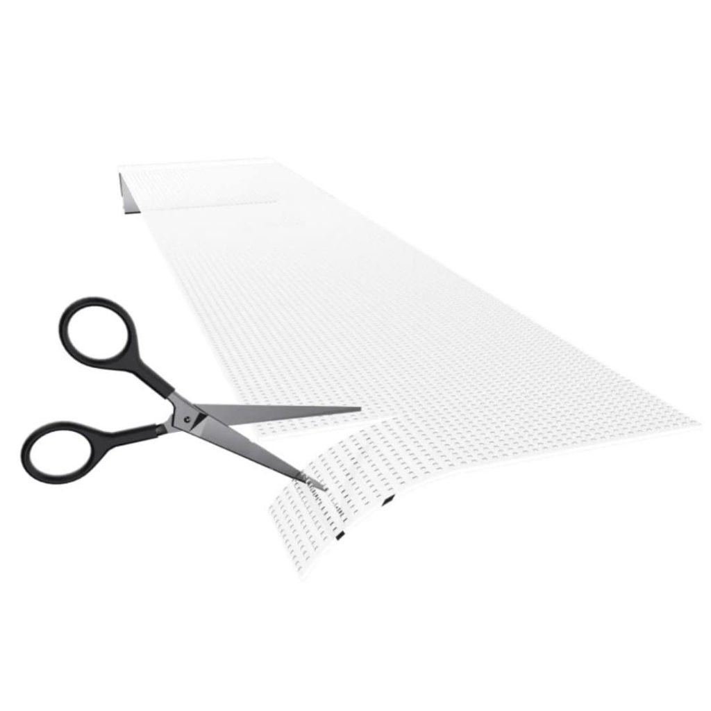 Transparent LED crystal film screen being cut to size with a pair of scissors