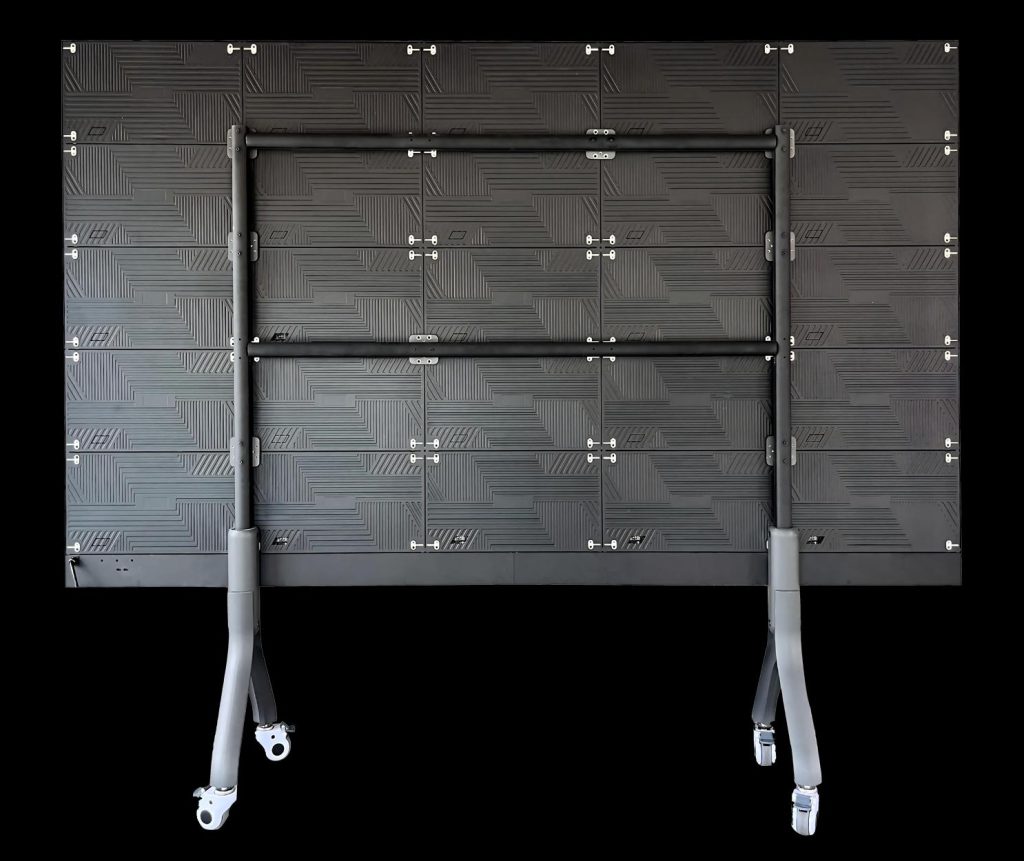 Rear view of the Titan all-in-one LED TV on its mobile stand, showing the modular panel back
